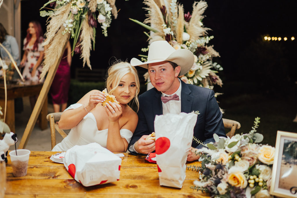 Bride and groom eating chick fil a Tyler Texas wedding